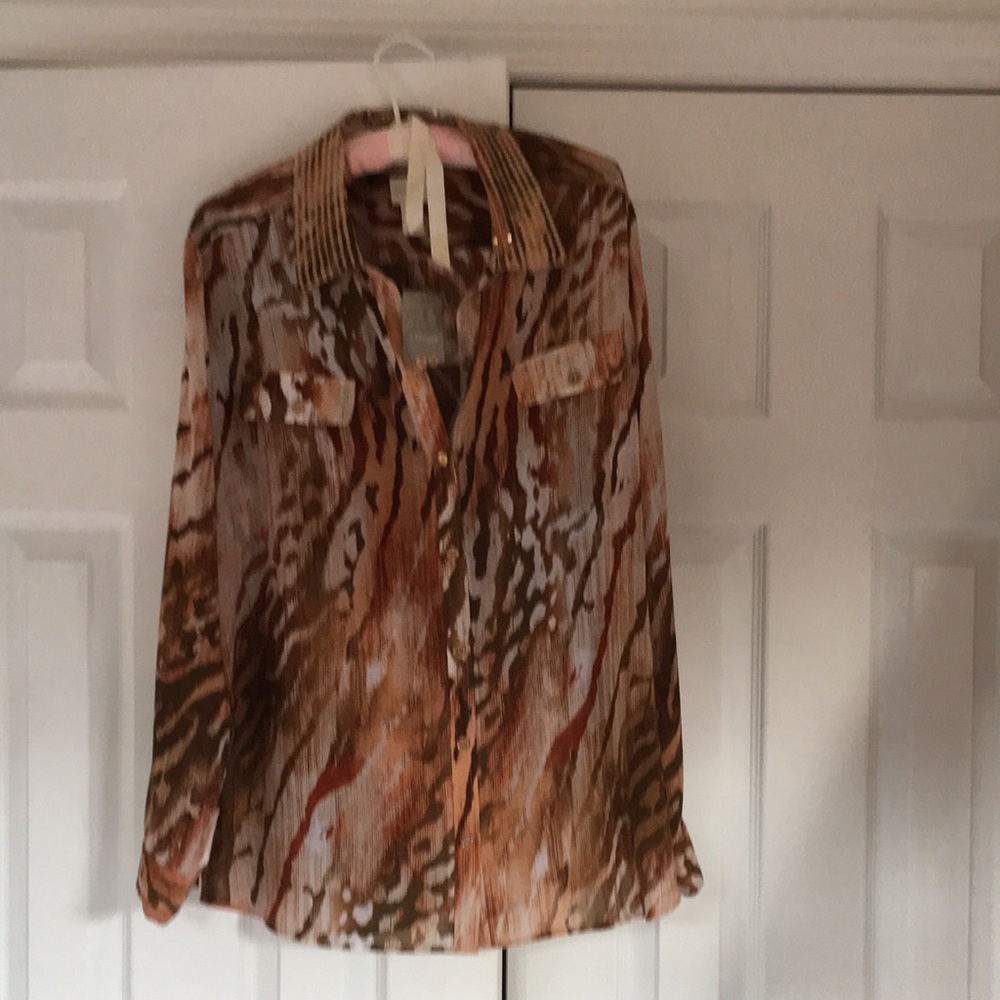 Blouse orange rusty color with other lighter shades of rust and olive green